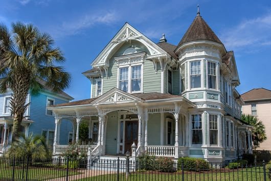 A historic East End or Strand Victorian home with divided-light wood-sash windows