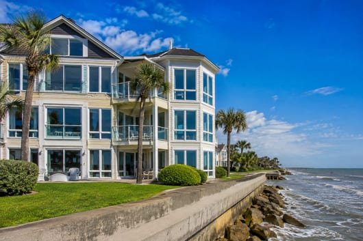 A seawall-facing condo with the salt-exposed side of the windows being cleaned
